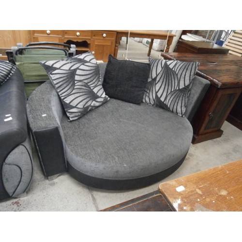 679 - Large grey cushioned settee and a matching circular settee