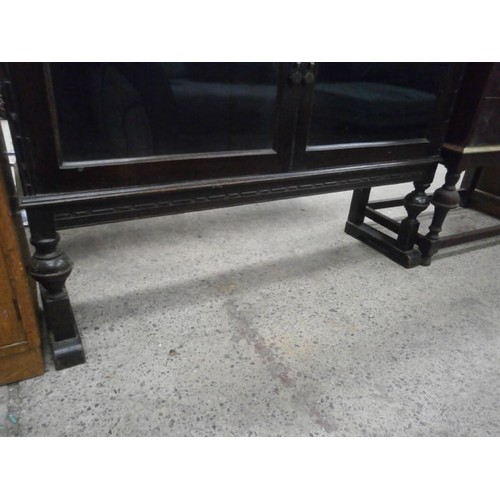 686 - Vintage ebonised 2 door glazed cabinet