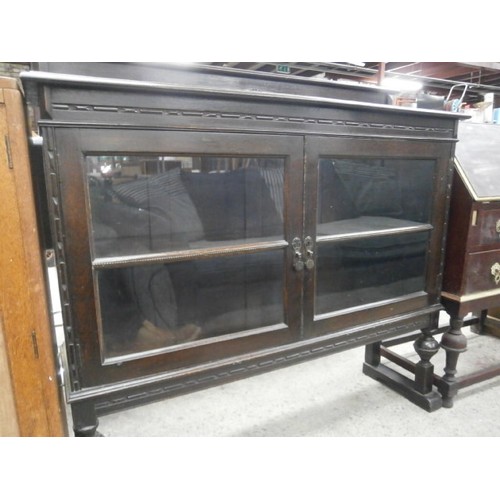 686 - Vintage ebonised 2 door glazed cabinet