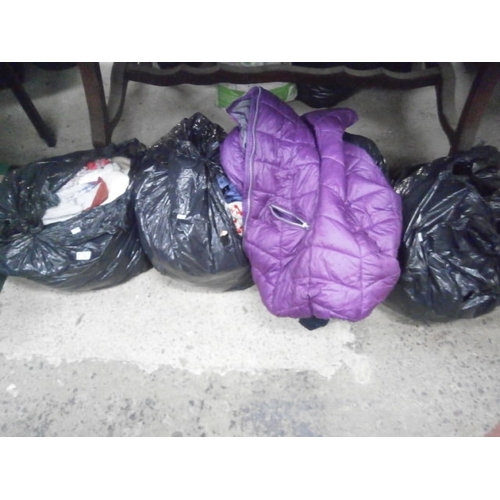 146 - Four bags of assorted clothing