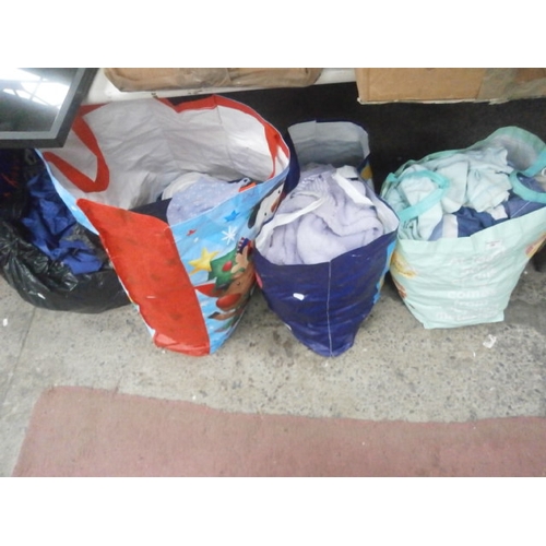 180 - Four bags of assorted clothing