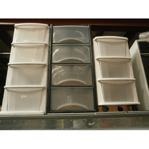 2 - Three plastic storage units