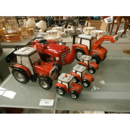 402 - Lot inc novelty tractor teapots, salt & pepper pots, money box, etc