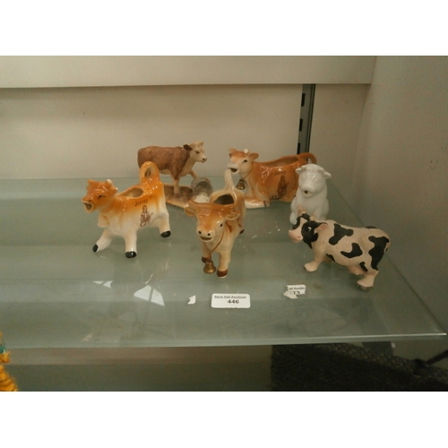 446 - Collection of cow ornaments, one as found