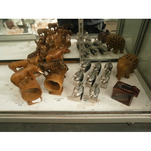 355 - Lot inc wood and metal animal napkin rings with elephant ornament and trick box