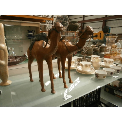 430 - Two leather camel figurines