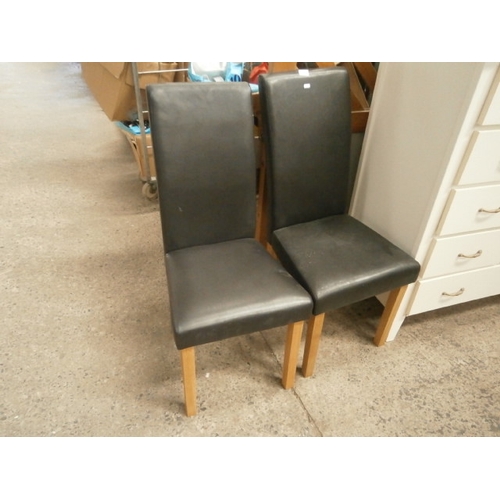 607 - Pair of high back faux leather dining chairs