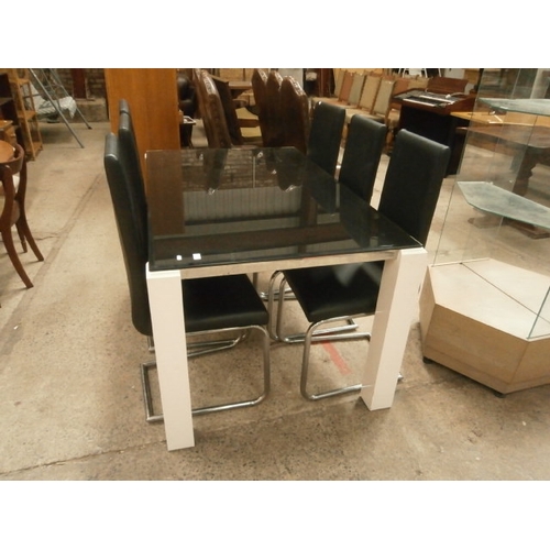 659 - Modern black glass topped dining table and 6 x matching chairs