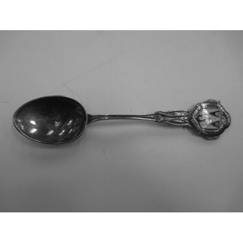 319 - Display shelf containing souvenir spoons, six spoons are silver hallmarked.