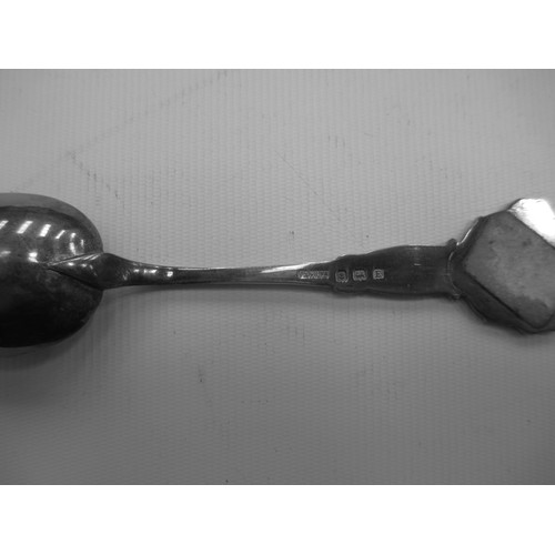 319 - Display shelf containing souvenir spoons, six spoons are silver hallmarked.