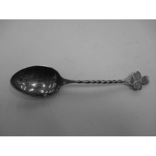 319 - Display shelf containing souvenir spoons, six spoons are silver hallmarked.