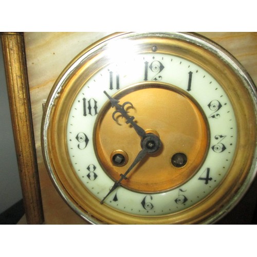 333 - Marble mantle clock with key, has damage to a corner