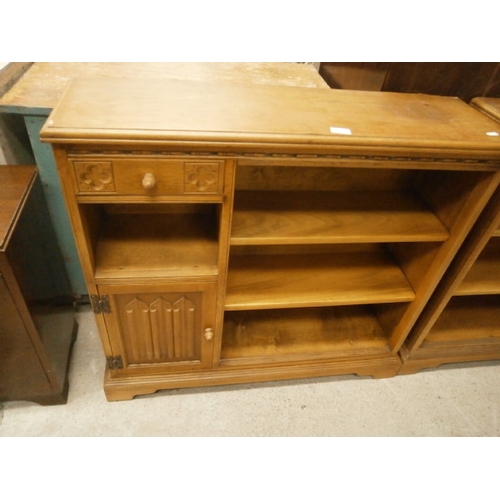 702 - Carved oak bookcase with linenfold cupboard