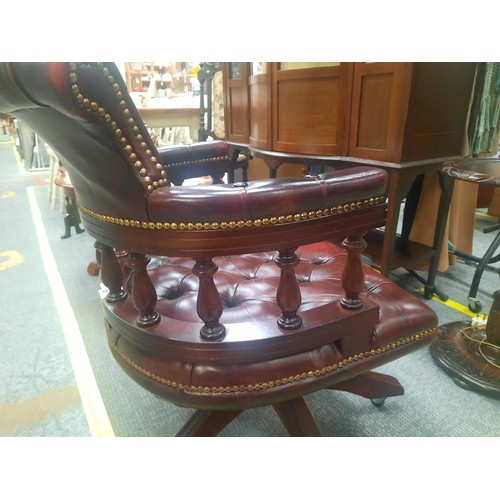 7 - Red leather chesterfield buttoned captains chair in very good condition