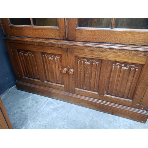 13 - Tall oak bookcase on double cupboard base with 4 glass shelves