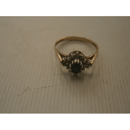 277 - 9ct hallmarked gold ring with white & black stones weight 2.14g size O