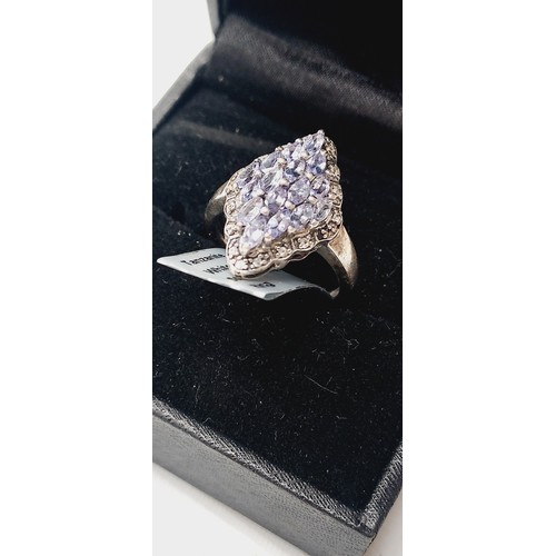 257 - Tanzanite & white topaz sterling silver ring stamped 925 weight 3.61G silver & 1.21cts stones with c... 
