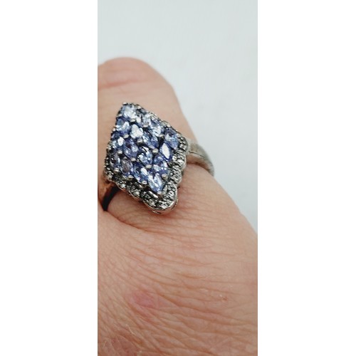 257 - Tanzanite & white topaz sterling silver ring stamped 925 weight 3.61G silver & 1.21cts stones with c... 