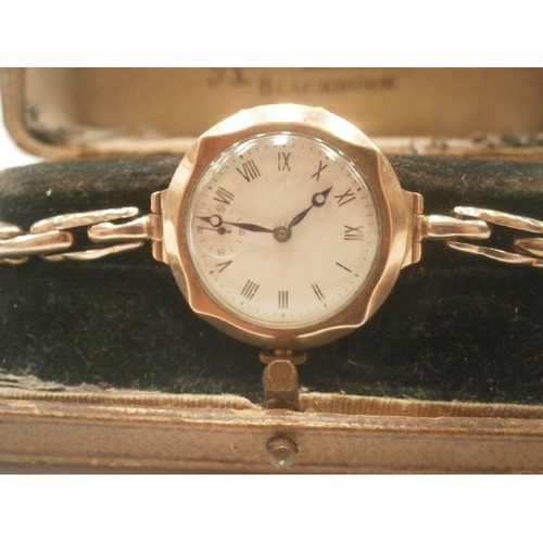 52 - 9ct gold ladies wristwatch in original case by Ainsworth & sons Blackburn, winds and ticks.