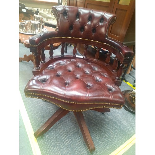 703 - Red leather chesterfield buttoned captains chair in very good condition