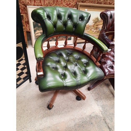 704 - Green leather chesterfield buttoned captains chair in very good condition