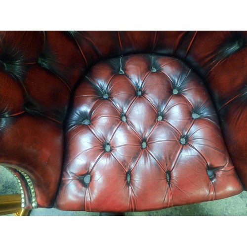 705 - Red leather chesterfield buttoned directors chair in very good condition