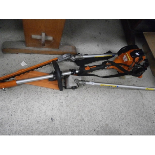 142 - Parker petrol strimmer with attachments