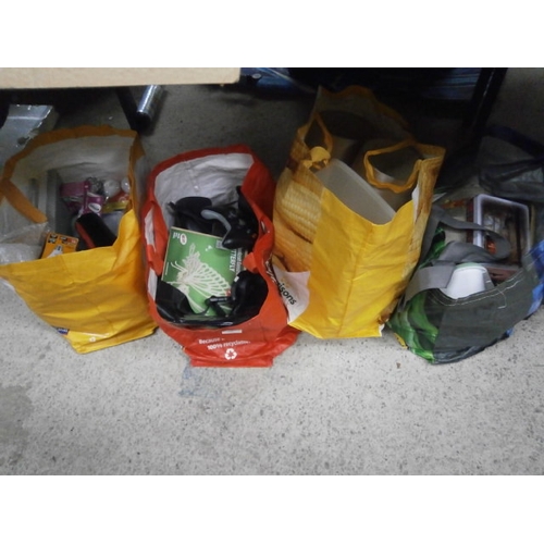 160 - Four bags inc table mats, Xbox controller, speakers, lightbulbs, Revlon hairdryer, etc