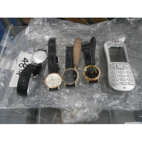 401 - Lot inc four assorted wristwatches and old mobile phone