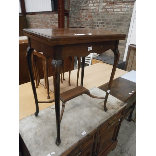 689 - Antique mahogany fold top window table