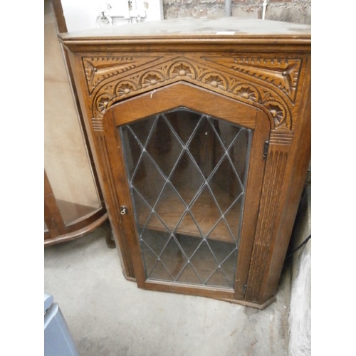 694 - Vintage lead glazed carved oak corner cabinet as found door