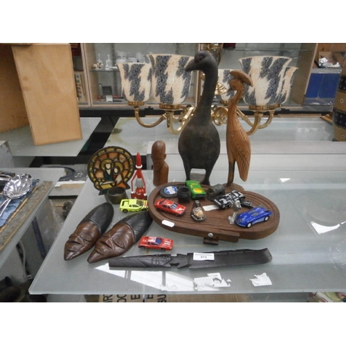 373 - Assorted items including a metal door stop and woodware figures