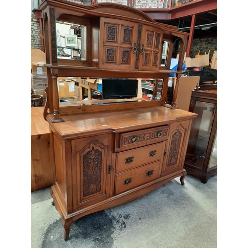 688 - Oak mirror back sideboard with carved panel doors & bevel edge mirrors in good condition