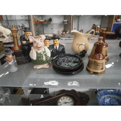 428 - Lot inc Laurel & Hardy figurines, Stoneware whisky bottles, Natwest piggy, etc