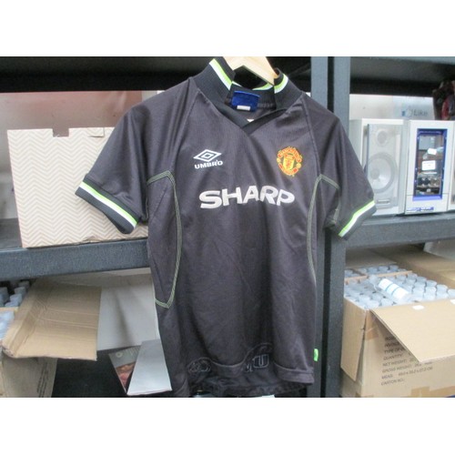 87 - Collection of football shirts, mostly Manchester United