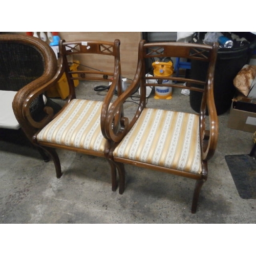 714 - Pair of vintage sabre legged elbow chairs