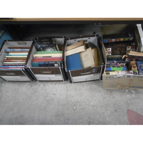 164 - Four boxes of assorted books