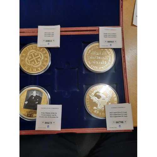 209 - Set of 4 giant gold plated coins all with C.O.As in wooden box