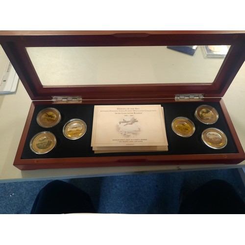 256 - Heroes of the sky antique finished gold plated medallion collection in wooden display case