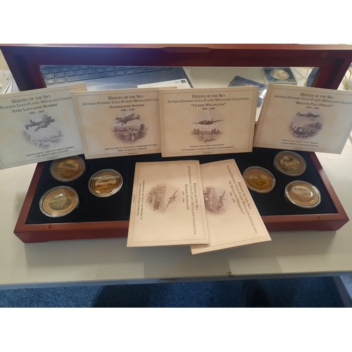 256 - Heroes of the sky antique finished gold plated medallion collection in wooden display case