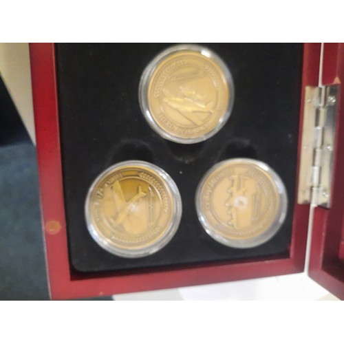 256 - Heroes of the sky antique finished gold plated medallion collection in wooden display case