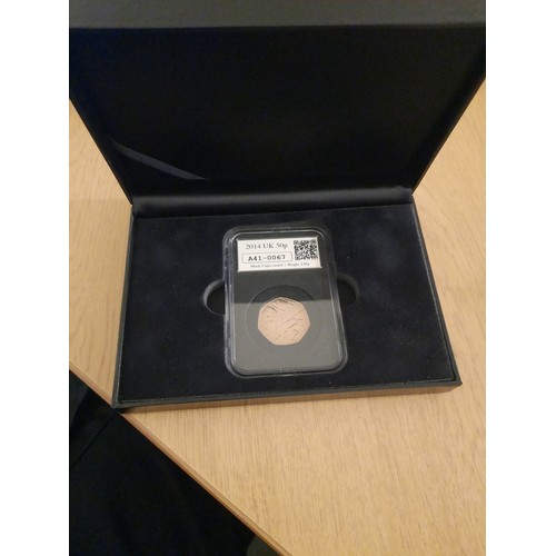 215 - A 2014 date stamp commonwealth games 50p coin in plastic case