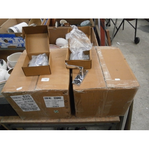 126 - Two boxes of new door handles