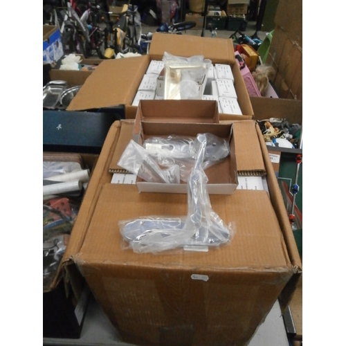 184 - Two boxes of new door handles