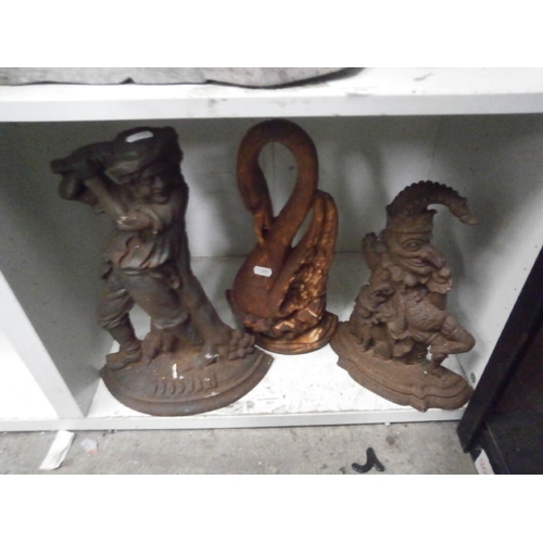 311 - Three vintage cast iron door stops