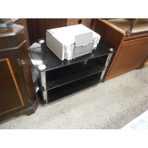 647 - A black glass TV stand and a LEXMARK printer