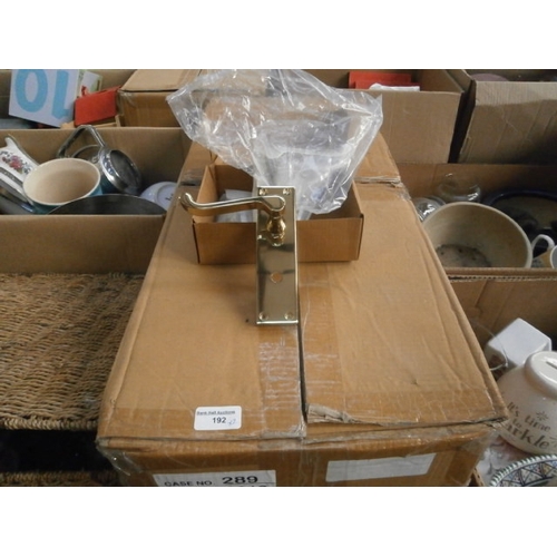 192 - Two boxes of new brass door handles