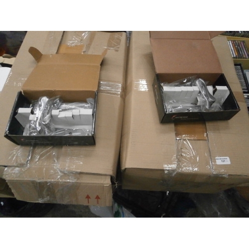 127 - Two boxes of new door handles