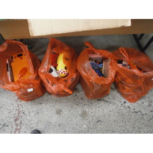 137 - Four bags of assorted toys