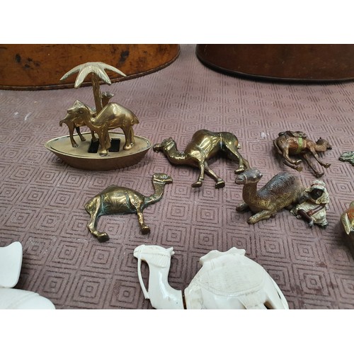 211 - Selection of camel ornaments inc brass